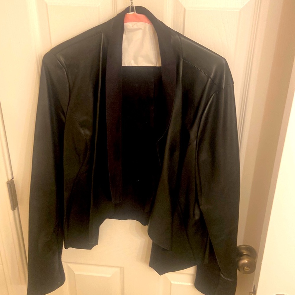 Pleather jacket with suede like material inside.